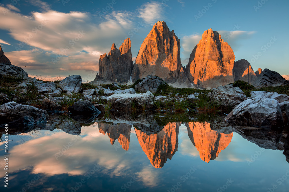 Tre Cime di Lavaredo with reflection in lake at sundown, Dolomites Alps - obrazy, fototapety, plakaty 
