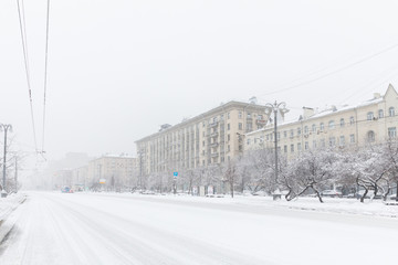 Wall Mural - Heavy snowfall in Moscow. houses and streets during blizzard