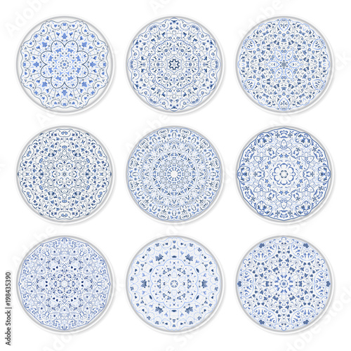 Fotografie, Obraz Set of decorative plates with a circular arabic blue pattern, top view