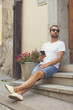 © Kitja - Modern guy using cellphone in the European city.