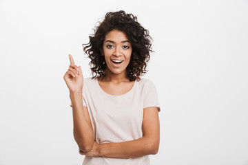 Wall Mural - Portrait of a happy young afro american woman