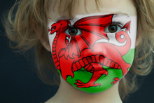 Portrait Of A Child With A Painted Welsh Flag