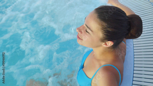 Beautiful Young Girl Woman Relaxed In A Spa In A Blue Bathing Suit