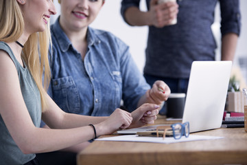 Two women sitting with a laptop