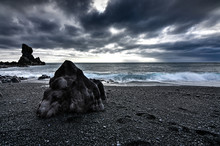 Amazing Rock Formations Made By Erstwhile Flowing Lava On A Black Sand Beach In Iceland