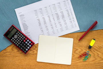 Wall Mural - template of financial accounting desk with white note pad, calculator and german statistics from abo