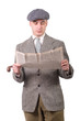 young man in vintage clothes with hat, reading a newspaper, 1940 style