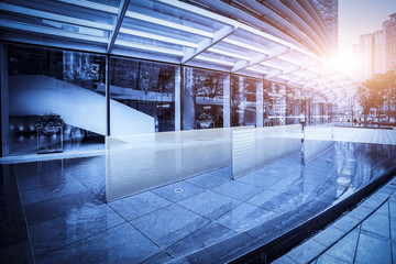 Poster - The entrance of the modern Enterprise Building, in the face view of the blue tone.