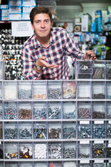 Wall Mural - Employee selling nuts, screw and fasteners