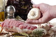 preparation of uncooked roast pork with mushrooms