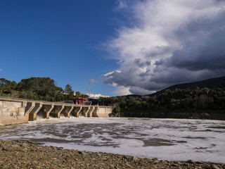 Storm on Torrejón dam open. Monfragüe National Park. Cáceres, Extremadura, Spain.