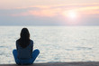 © Nickolay Khoroshkov - Profile of a woman silhouette watching sun on the beach at sunset