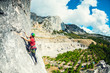 © zhukovvvlad - Girl climbs the rock.