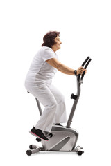 Sticker - Elderly woman working out on a stationary bike