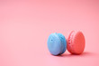 Blue and Pink  macaroons on pink background.