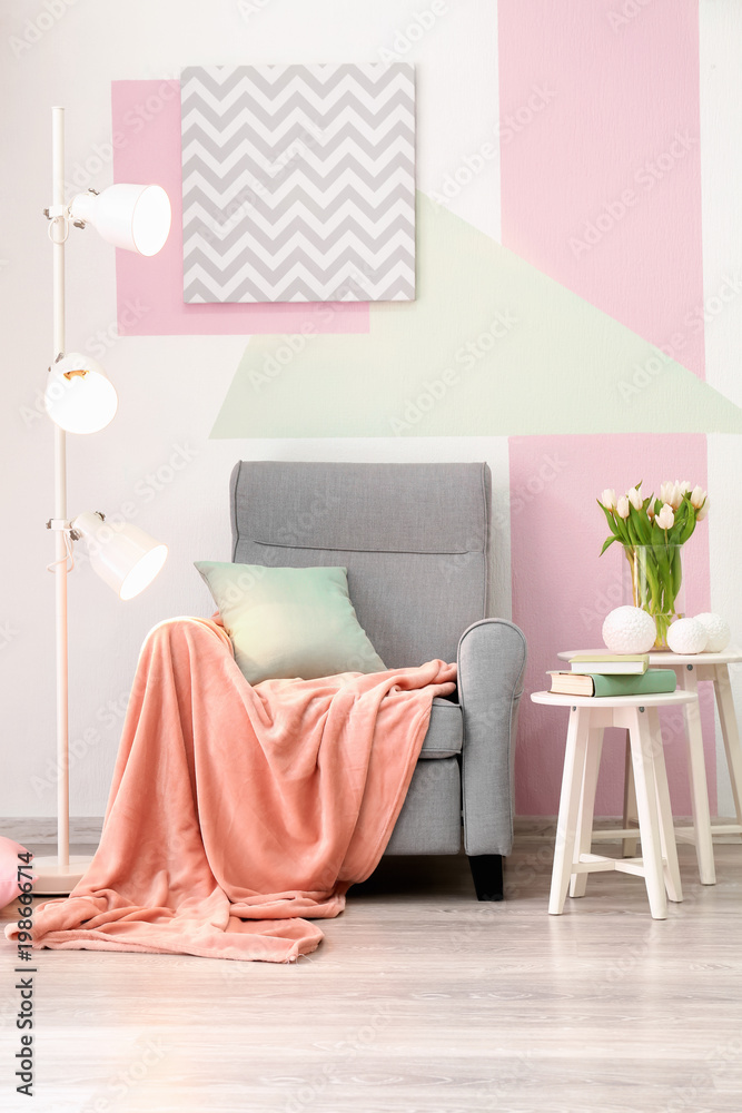 Elegant living room interior with comfortable armchair