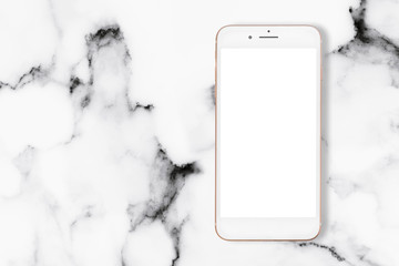Poster - Top view of smartphone on white marble table.