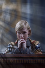 Wall Mural - Portrait of a beautiful woman praying in churches. (religion, faith, meditation concept)