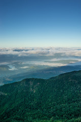 Wall Mural - view of landscape on hill and blue sky with cloud and fog