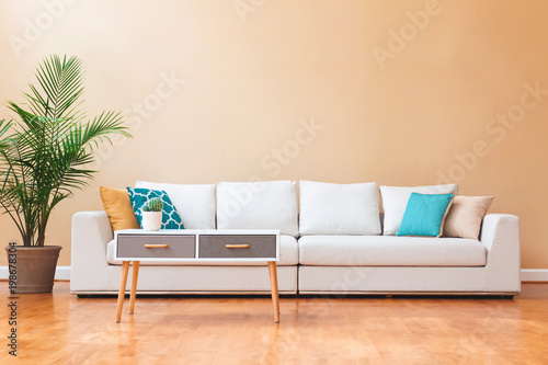 Fotografia, Obraz White couch in a large luxury interior home