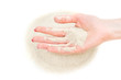 © igorkol_ter - Sand running through female's hand on heap. Isolated on white. Time running out concept. Top view.
