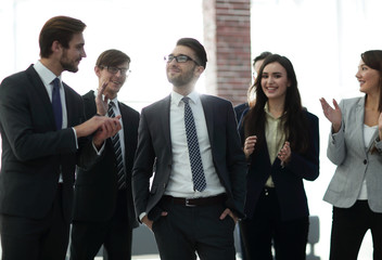 Group of happy business people congratulating their successful c