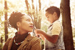© Mladen - African American mother playing with her daughter.