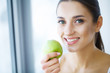 © Maksymiv Iurii - Woman With Apple. Beautiful Girl With White Smile, Healthy Teeth. High Resolution Image
