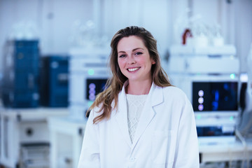 Wall Mural - young woman scientist working in a laboratory