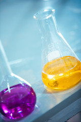 Wall Mural - laboratory equipment. different glasswares with color liquid in a laboratory