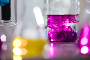 Wall Mural - laboratory equipment. different glasswares with color liquid in a laboratory