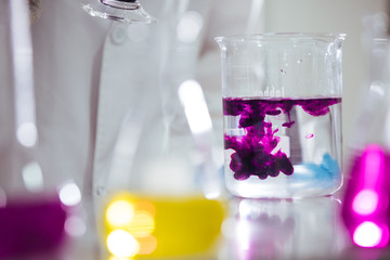 Wall Mural - laboratory equipment. different glasswares with color liquid in a laboratory