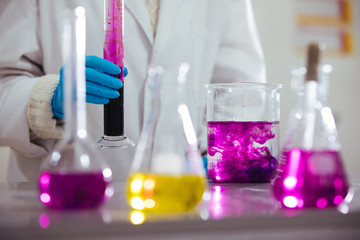 Wall Mural - laboratory equipment. different glasswares with color liquid in a laboratory