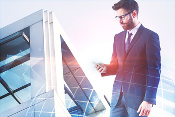 Poster - Businessman using cellphone with globe