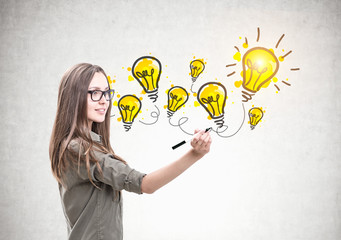 Wall Mural - Smiling woman with a marker, bright idea