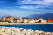Beautiful cityscape, Ajaccio is the capital of Corsica. City on a background of snowy mountains and blue sky