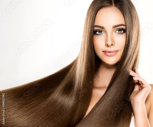 Beautiful Model Girl With Shiny Blonde Straight Long Hair Care
