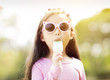© Tom Wang - happy little girl eating popsicle at summertime.