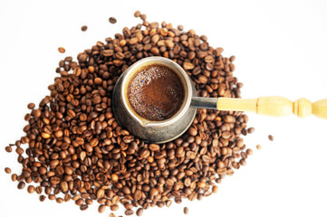 coffee pot and coffee beans isolated on white