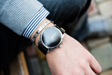 Stylish man in gray jumper, elegant business man's hand with fas