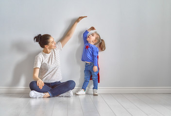 Mother is measuring growth of child