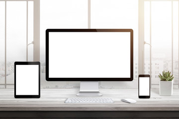Poster - Responsive web site promotion. Isolated blank computer, tablet and smart phone display. Window and sun light in background.