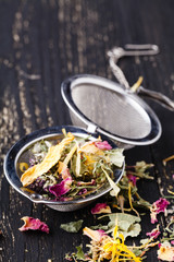 Wall Mural - Dry herblal tea lay on wooden table