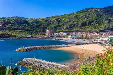 Wall Mural - Beautiful landscape with Machico cityscape, coastline and the beach in a sunny day, in Madeira - Portugal