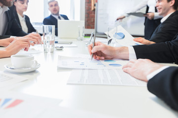 Wall Mural - Business people discuss charts