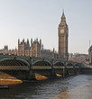 The historic Houses of Parliament with Westminster Bridge in the foreground.