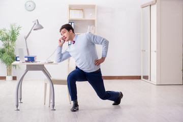 Employee doing stretching exercises in the office