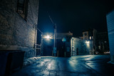 Fototapeta Uliczki - Dark and eerie urban city alley at night.