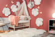 © Africa Studio - Interior of beautiful modern children's room with crib