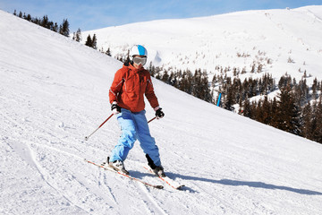 Poster - Woman skiing downhill at snowy resort. Winter vacation